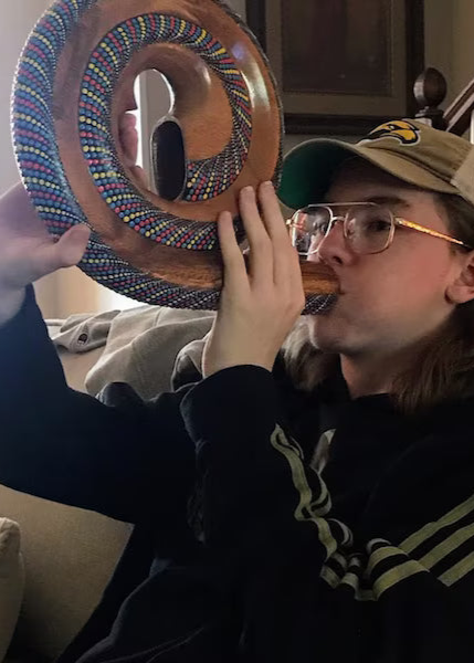 Spirald Didgeridoo Being Played By a young man inside
