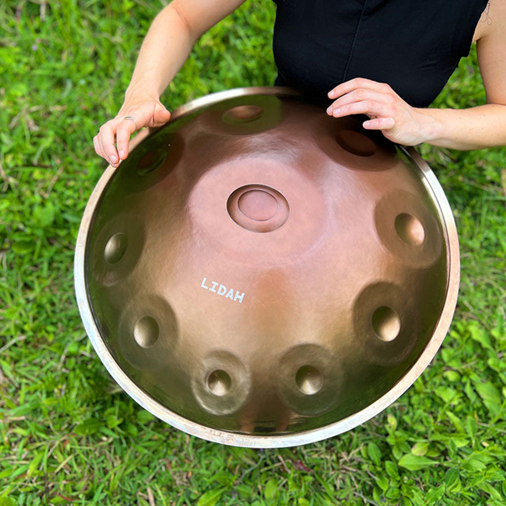 Musician performing with LIDAH® Stainless Steel Handpan outdoors