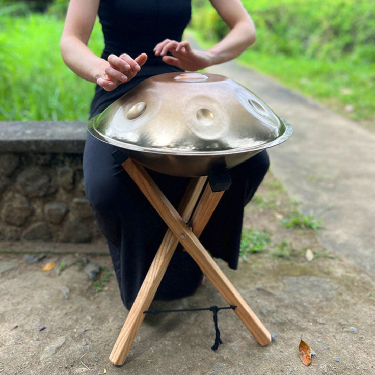 Mini Handpan displayed on wooden stand in Outside