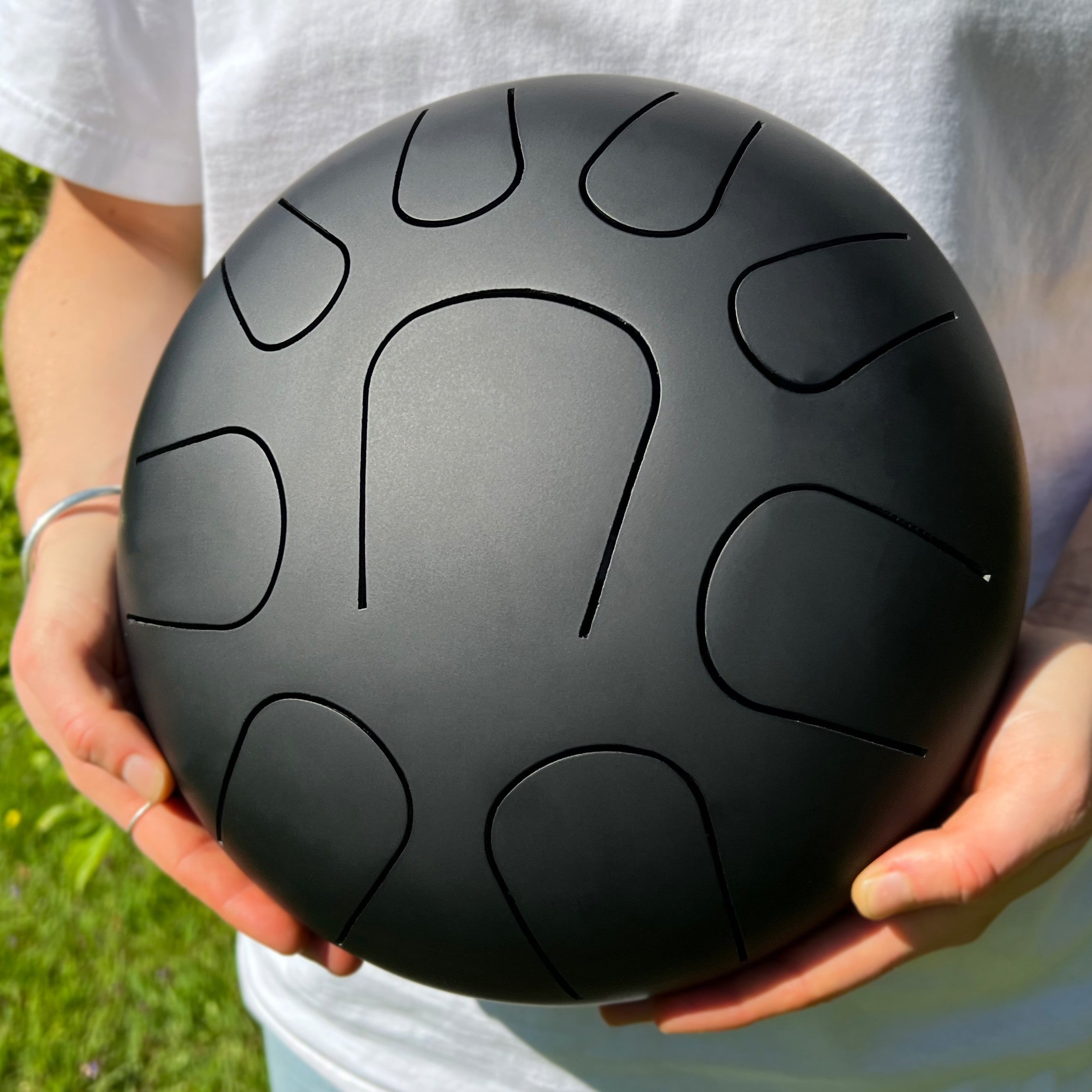 LIDAH® Steel Tongue Drum Black Held In Nature by Musician